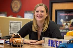 An Arizona Motor Vehicle Express team member at the dealer services desk